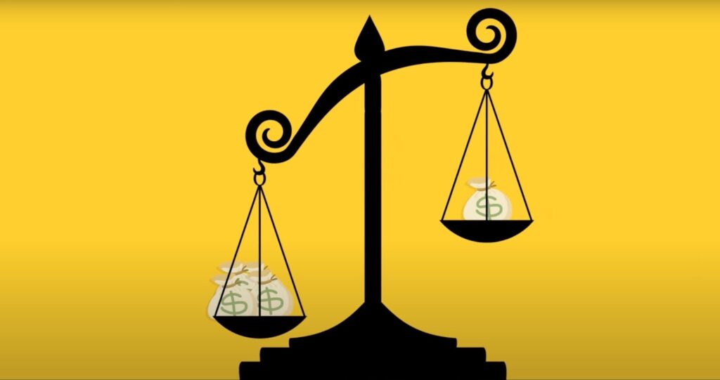 Scales with money on a yellow background