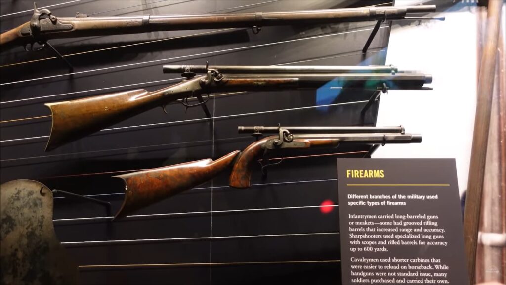 three forearms behind glass and a note with historical information on it